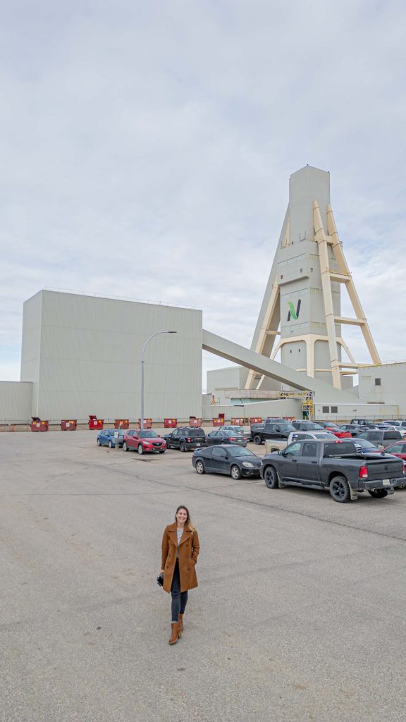 A woman standing in front of the mainframe at a Nutrien potash mine,